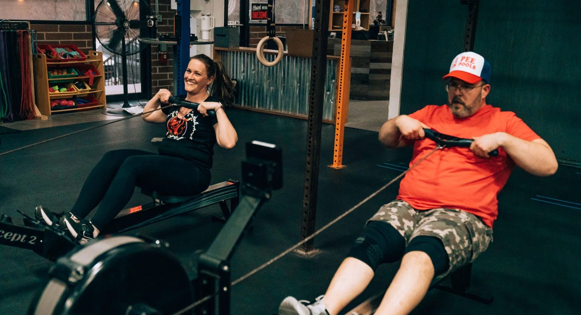 People using rowing machine