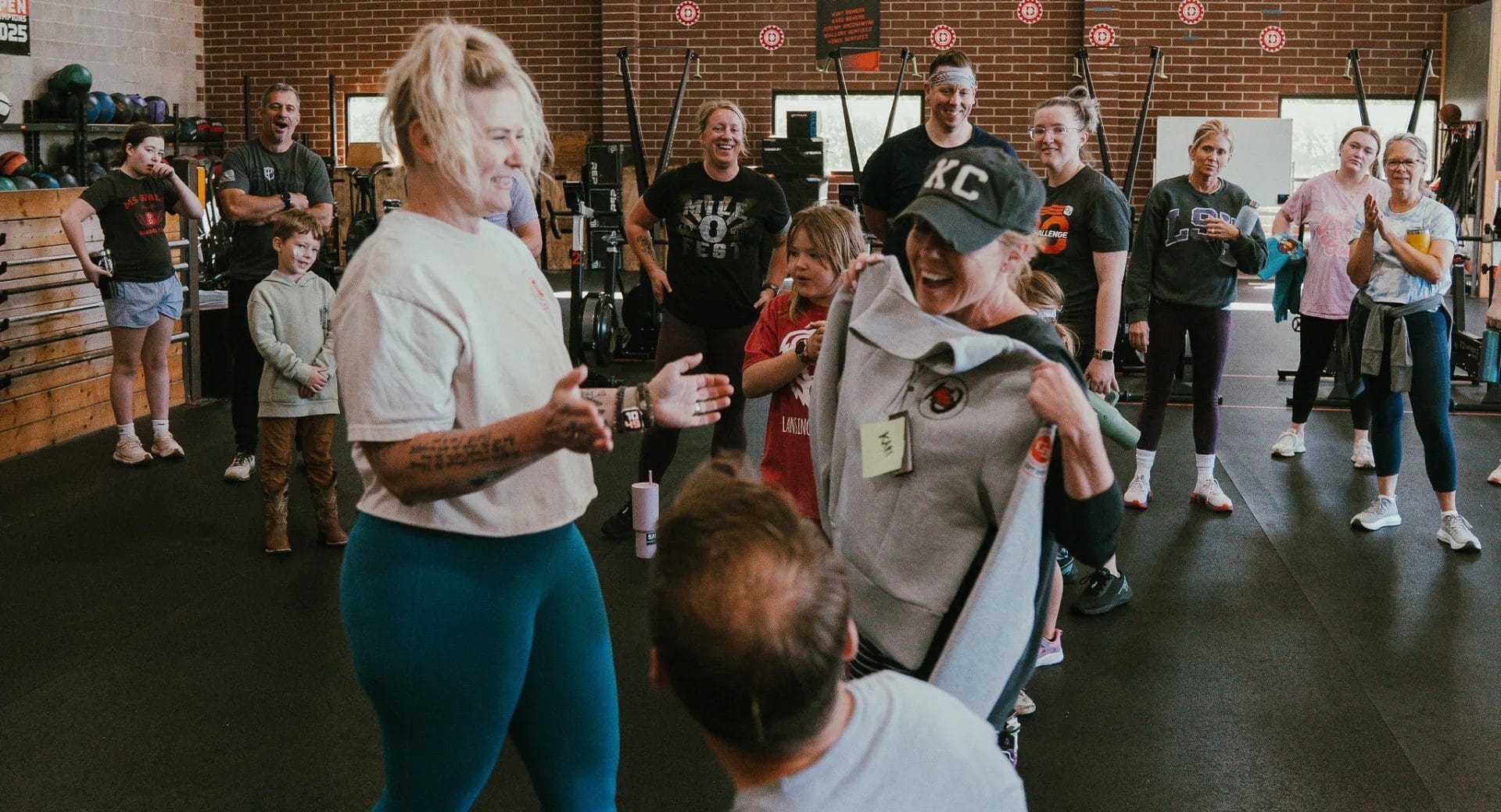 Happy smiling people at the gym