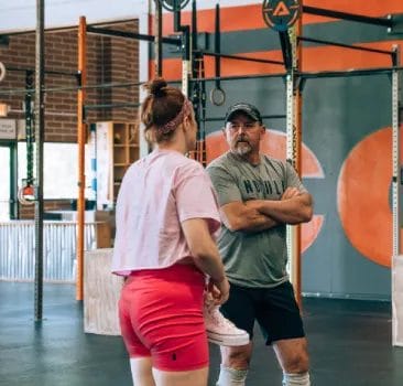 Woman talking with a coach